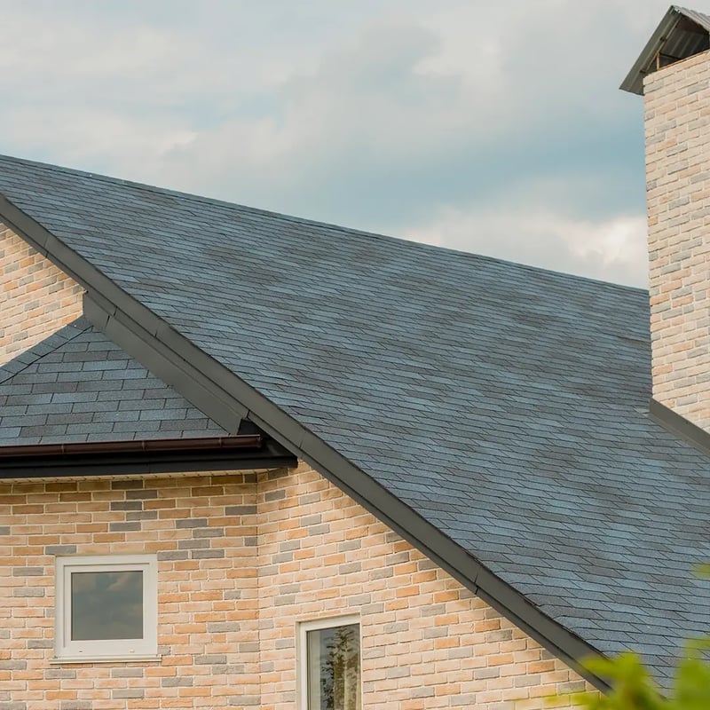 Modern composite shingles being installed